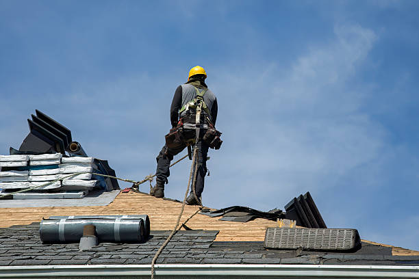 Professional Roofing technician working in Manchester, MA